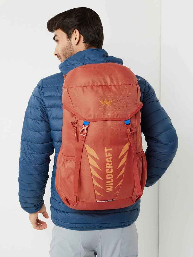 Wildcraft Travel Pro 30 L Rucksack in Pumpkin — worn by a model, rear view