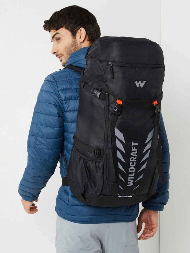 Wildcraft Travel Pro 40 L Rucksack in Black — worn on model's back, three-quarter view
