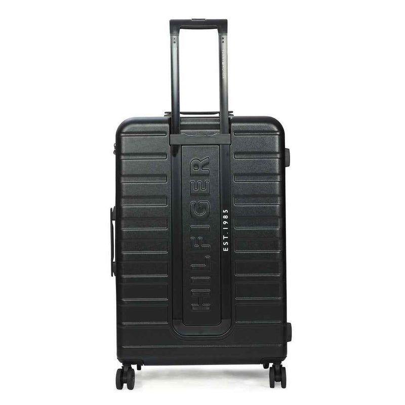Tommy Hilfiger Hoover X Hardside Trolley Bag in Black — back view with embossed Hilfiger logo