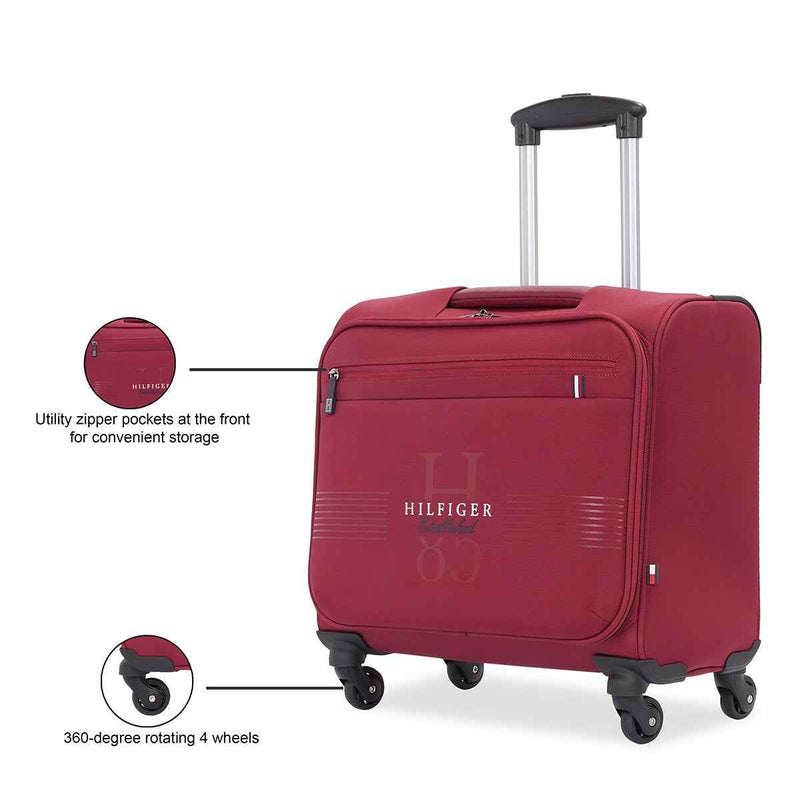 Tommy Hilfiger Formington Polyester Overnighter Cabin Bag in Burgundy — front zip pockets and 4-wheel callouts