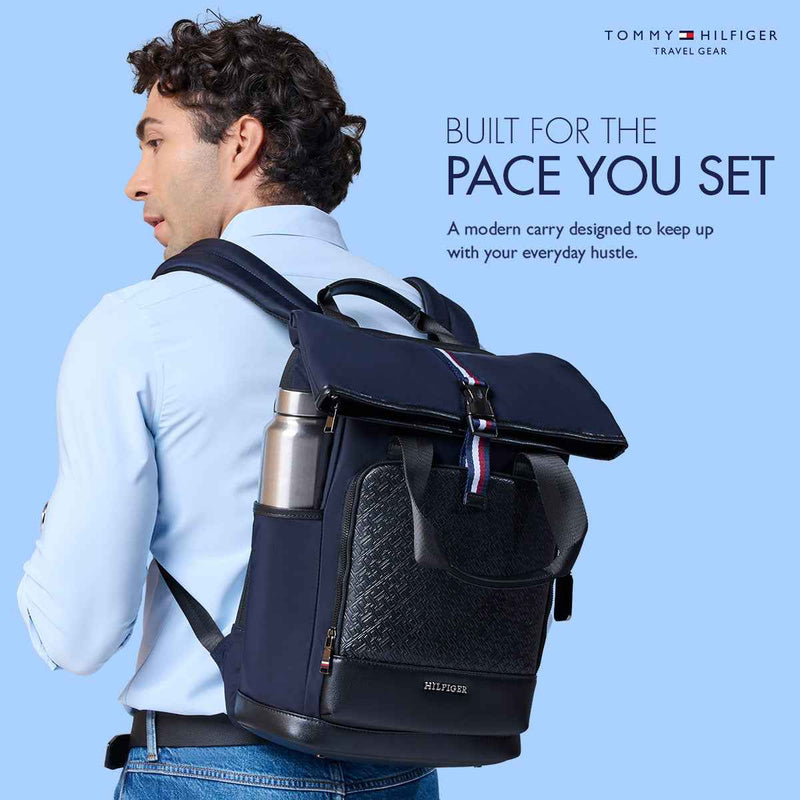 Tommy Hilfiger Slate 22.5L Twill Laptop Backpack in Navy — lifestyle shot, model wearing the backpack