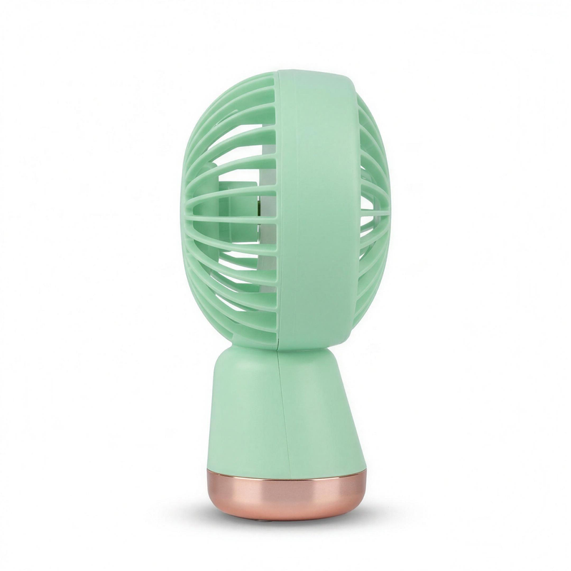 Side profile of the LS mint green handheld mini fan showing the rounded head and rose-gold band at the base of the handle