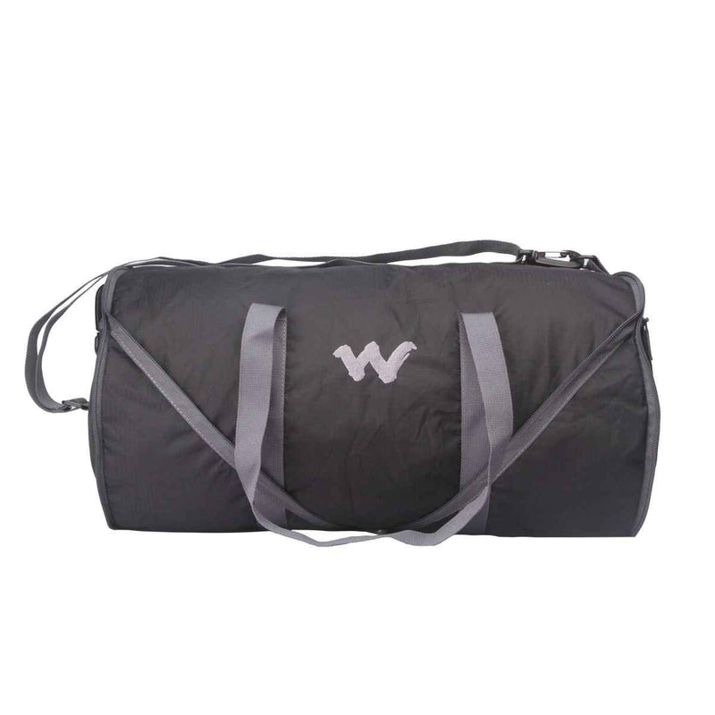 Wildcraft Frisbee Compressible Duffle Bag in Black — side view with grab handles and W logo