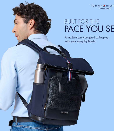 Tommy Hilfiger Slate 22.5L Twill Laptop Backpack in Navy — lifestyle shot, model wearing the backpack