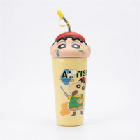 Shinchan kids sipper bottle in pale yellow with a moulded character head lid, red cap and fitted straw